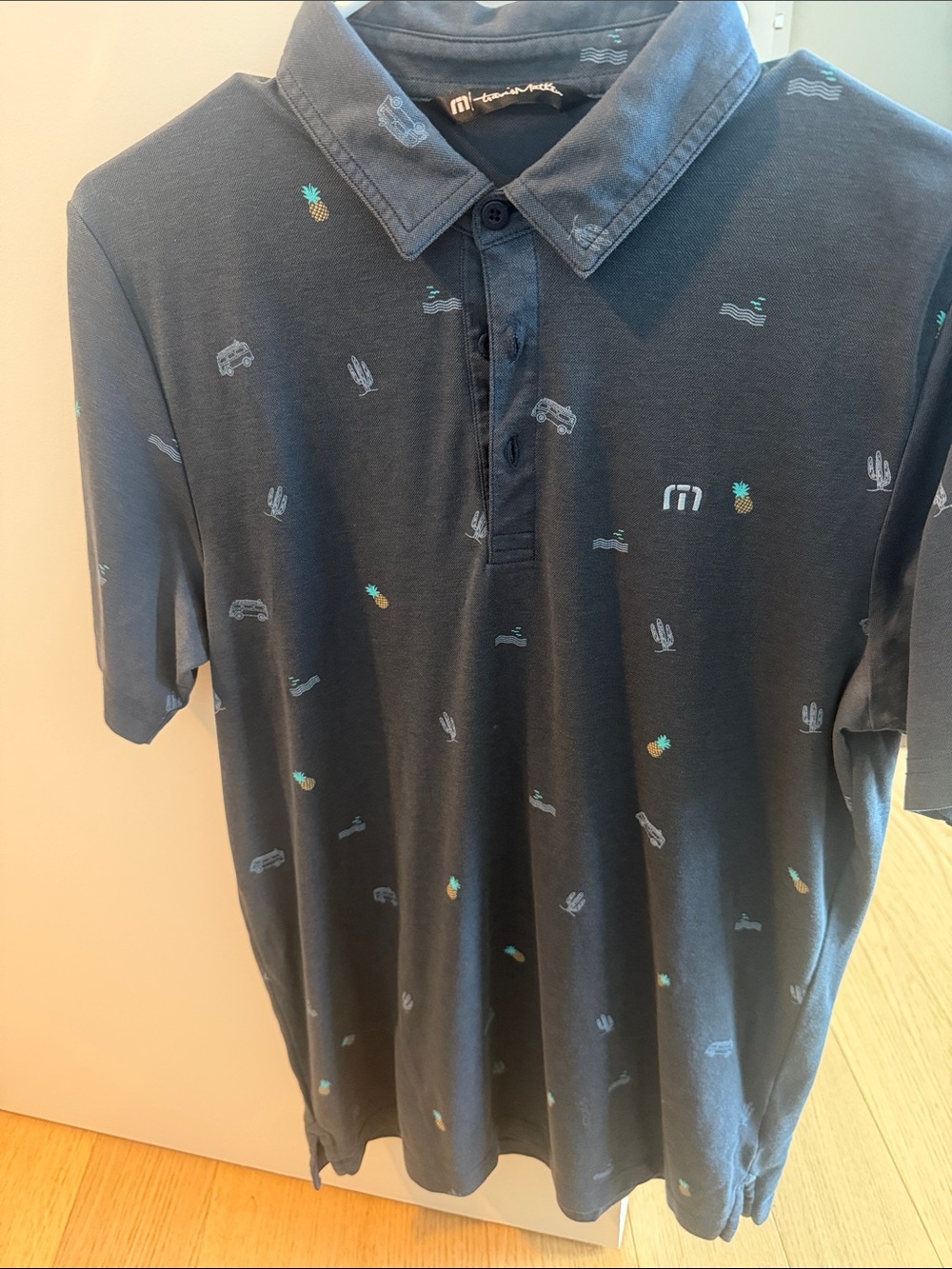 Travis Mathew Dark Blue Polo with Pineapple & Cactus Print